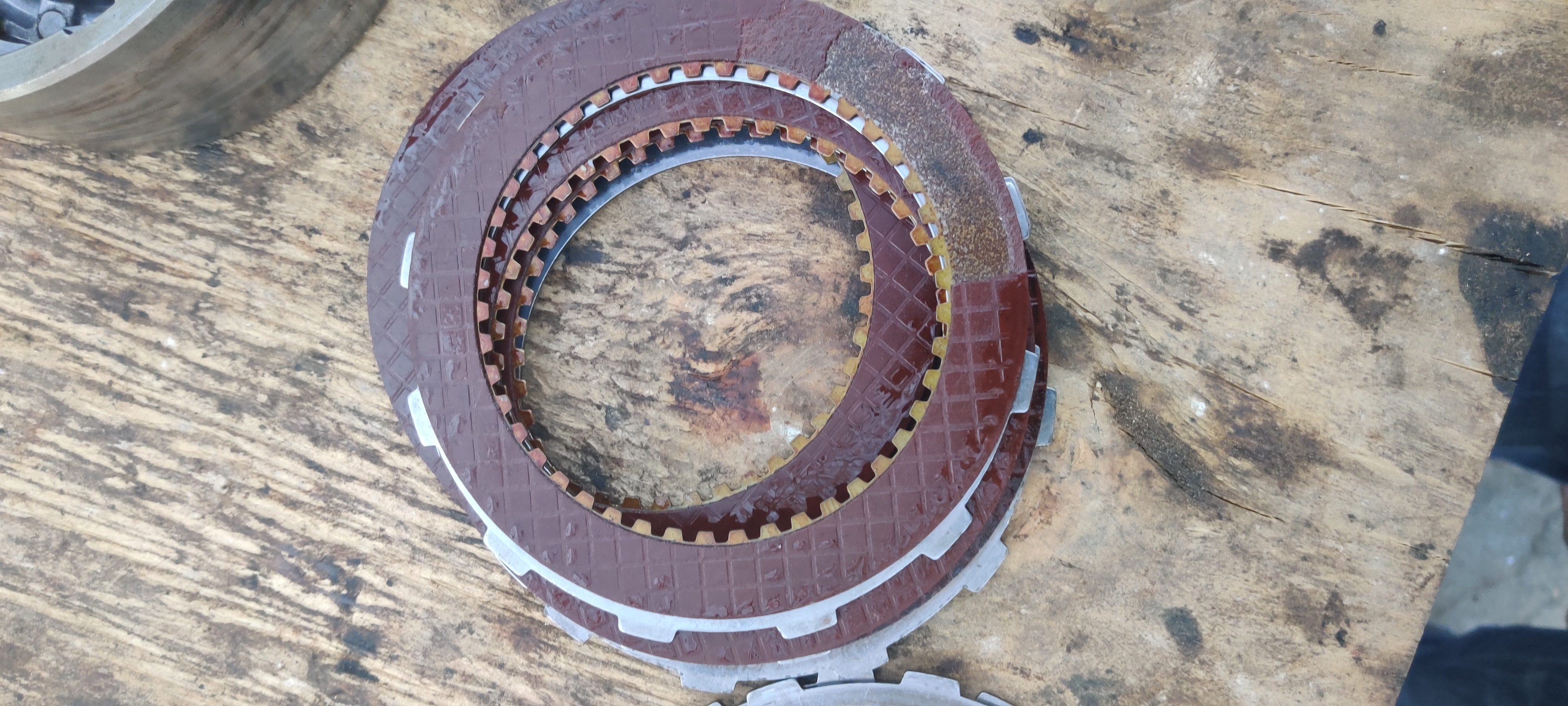 Friction Plates that transfer the engine power to the driveshaft. See the piece missing from it?